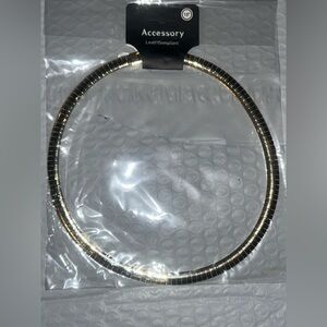 18” Gold tone choker necklace.